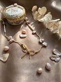 The Aphrodite Bow & Iridescent Baroque Pearl Necklace