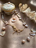 The Aphrodite Bow & Iridescent Baroque Pearl Necklace